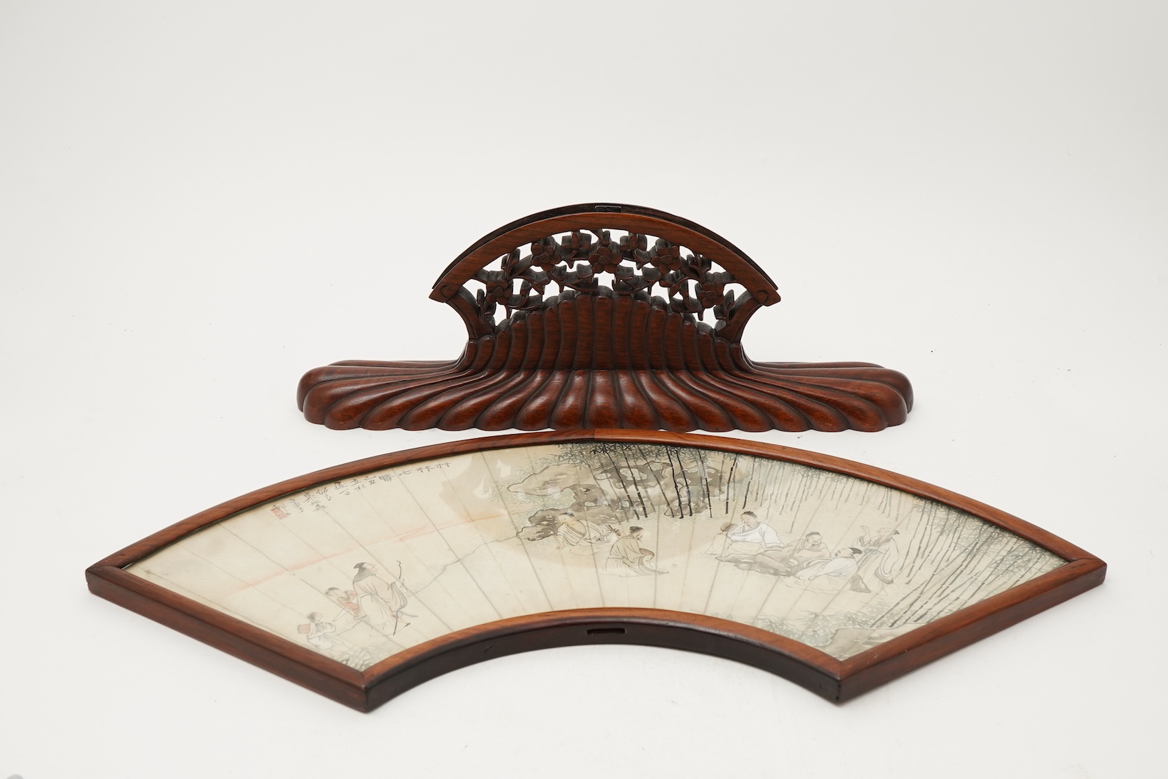 A Chinese painted paper fan leaf, 19th century, with hongmu frame and stand, early 20th century